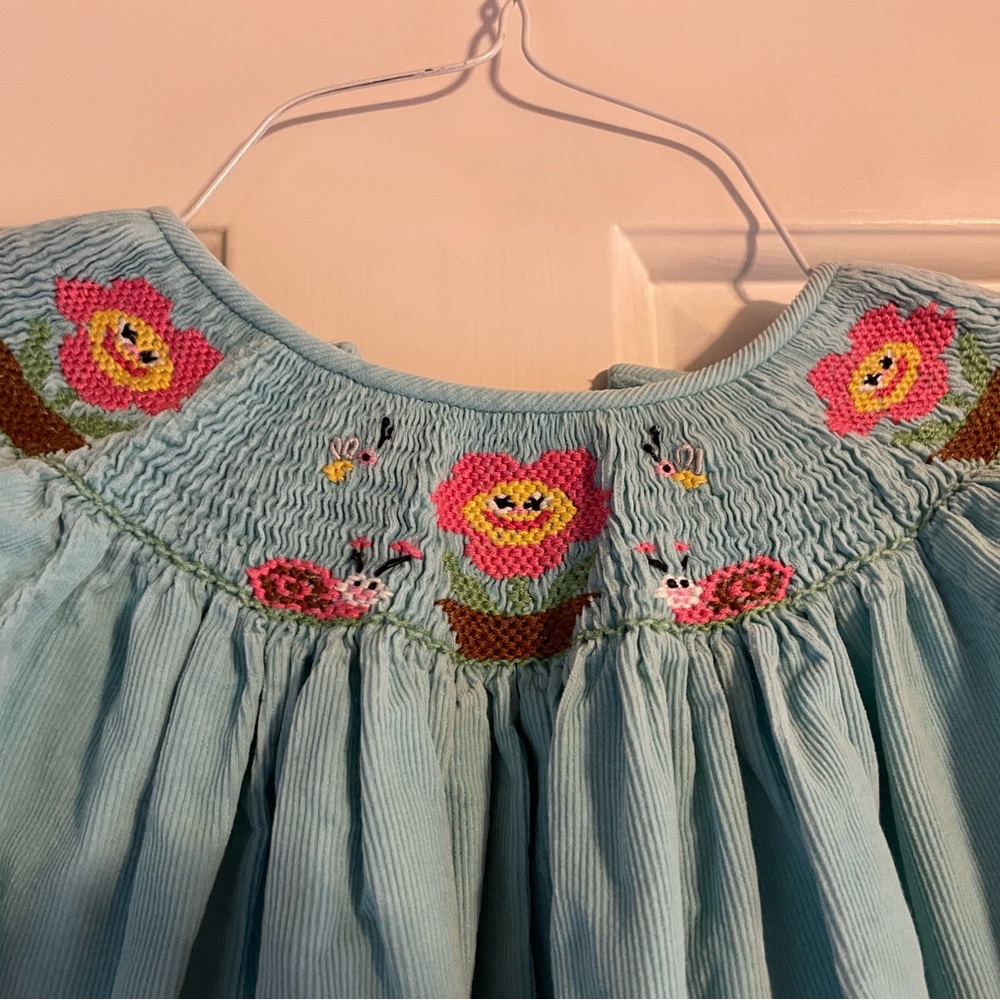 Light blue smocked corduroy dress.